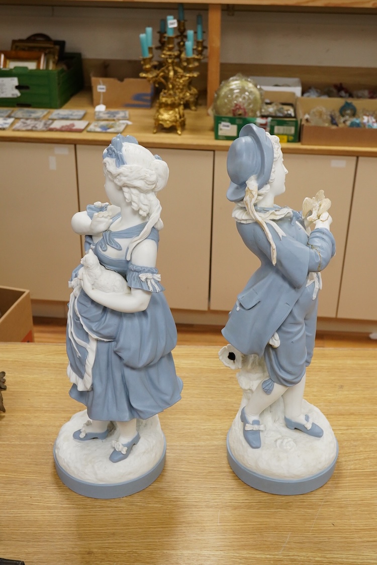 A pair of French part-bisque figures, 57cm high